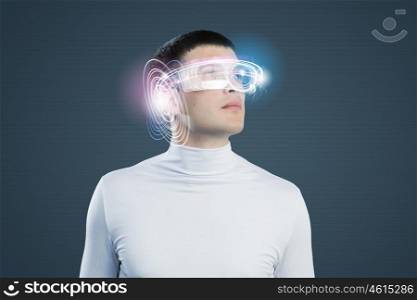 Innovative technologies. Young handsome man with hologram around head