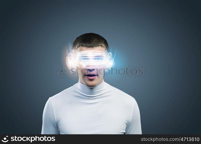 Innovative technologies. Young handsome man with hologram around head