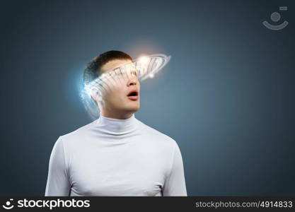 Innovative technologies. Young handsome man with hologram around head