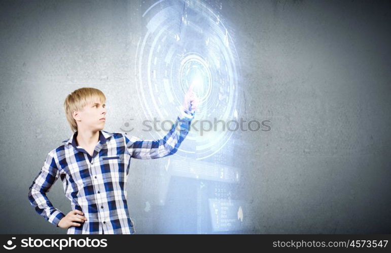 Innovative technologies. Young man in casual touching icon of media screen