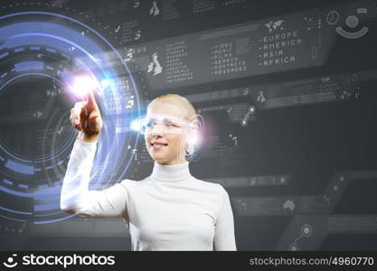 Innovative technologies. Young woman in white touching icon of media screen