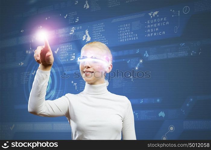 Innovative technologies. Young woman in white touching icon of media screen