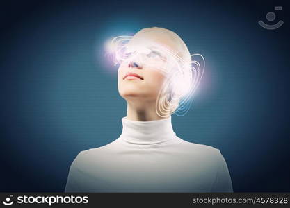 Innovative technologies. Young woman in white with hologram round head