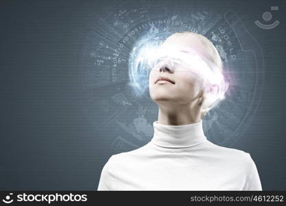 Innovative technologies. Young woman in white with hologram round head