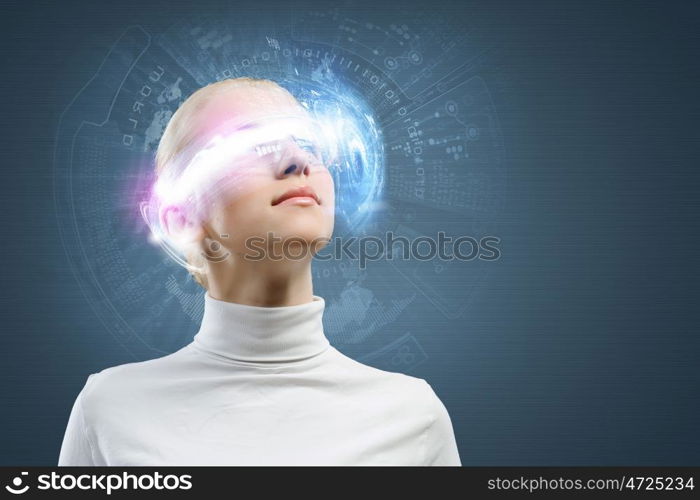 Innovative technologies. Young woman in white with hologram round head