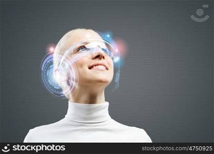 Innovative technologies. Young woman in white with hologram round head
