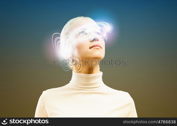 Innovative technologies. Young woman in white with hologram round head