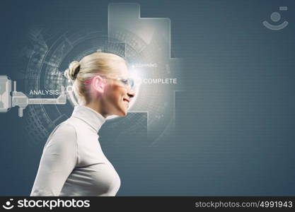 Innovative technologies. Young woman in white with hologram round head