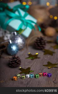 inscription Christmas and group of gifts on the background of garlands