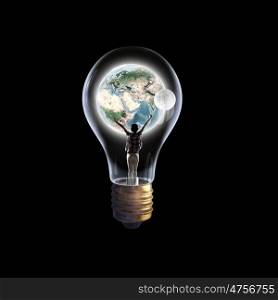 Inside of idea. Cheerful girl inside of glass light bulb. Elements of this image are furnished by NASA
