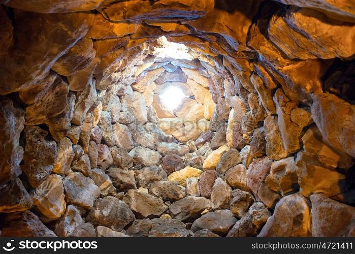 Inside the ancient tower well. Nuraghe culture, Sardinia, Italy