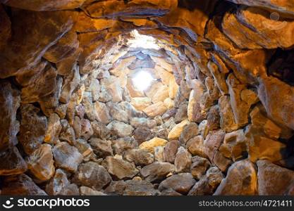 Inside the ancient tower well. Nuraghe culture, Sardinia, Italy