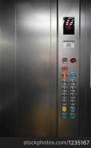 Inside the metal elevator floor selection buttons. Element of design.