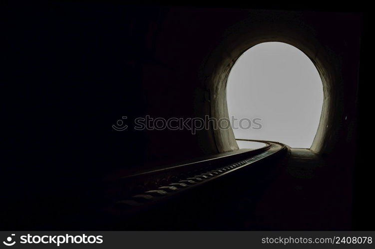 Inside the railroad tunnel and railways with natural light at the end. Light at the end of the tunnel, Lights and shadows, Concept of achieving your goals, Copy space, No focus, specifically.