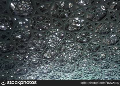 Inside the web patterned dome reflecting the green colour of the Persian Gulf waters, in Abu Dhabi, UAE, United Arab Emirates