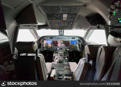 Inside view Cockpit G550. Inside view Cockpit G550 with blue sky and clouds