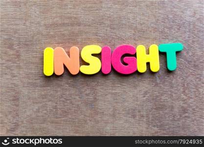 insight word in wood background