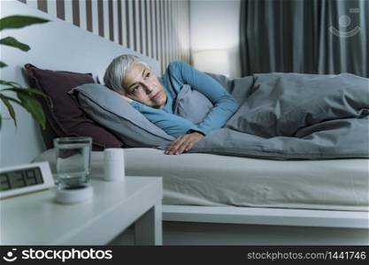 Insomnia - Sleep Disorder. Worried Senior Woman Suffering from Insomnia, Lying in Bed, Staying Awake Late at Night