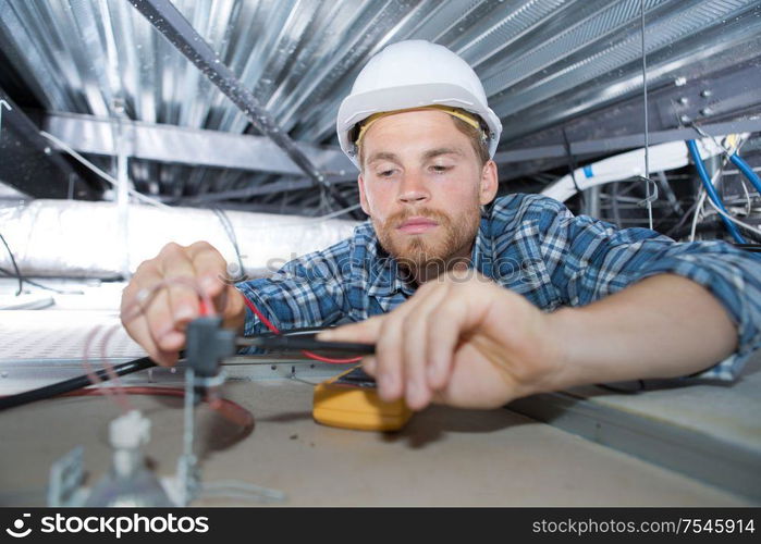 inspecting the lines on the ceiling