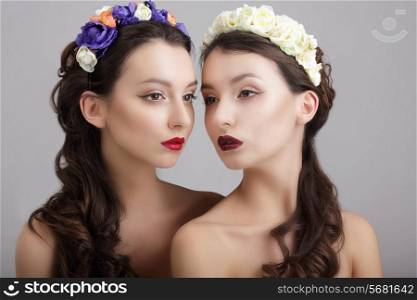 Inspiration.Two Styled Females with Wreaths of Flowers