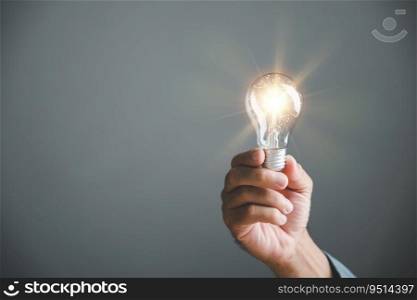 Inspirational image of a person holding a light bulb, embodying the concept of creative thinking, innovation, and solution-oriented approaches. This idea empowers business success.