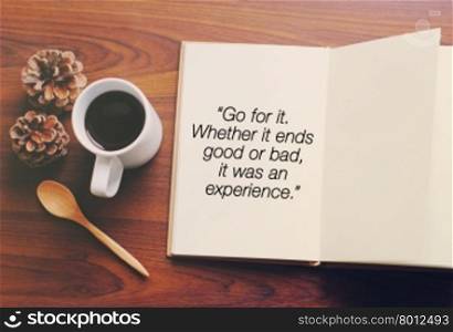 Inspirational motivating quote about life on notebook and coffee