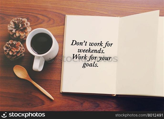 Inspirational motivating quote about success on notebook and coffee