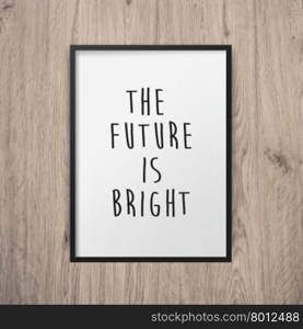 Inspirational motivating quote poster on frame with wooden wall background