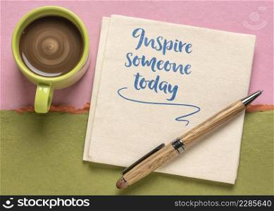 inspire someone today advice - inspirational handwriting on a napkin with cup of coffee