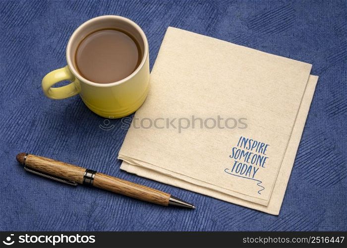 inspire someone today reminder note or advice - inspirational handwriting on a napkin with cup of coffee