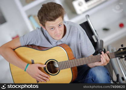 inspired disabled man playing a song