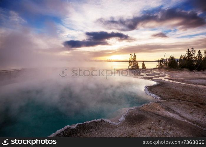 Inspiring natural background. Wooden boardwalk along geyser fields in Yellowstone National Park, USA.