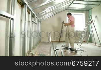 Installation of gypsum plasterboard ceilings - cutting drywall track