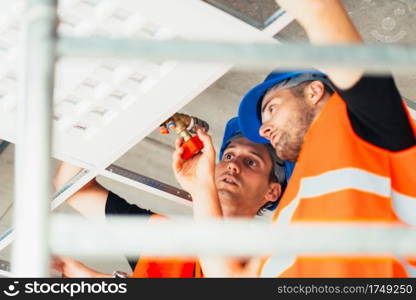 Installation workers working on construction site