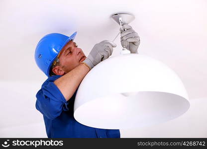 Installing the ceiling light.