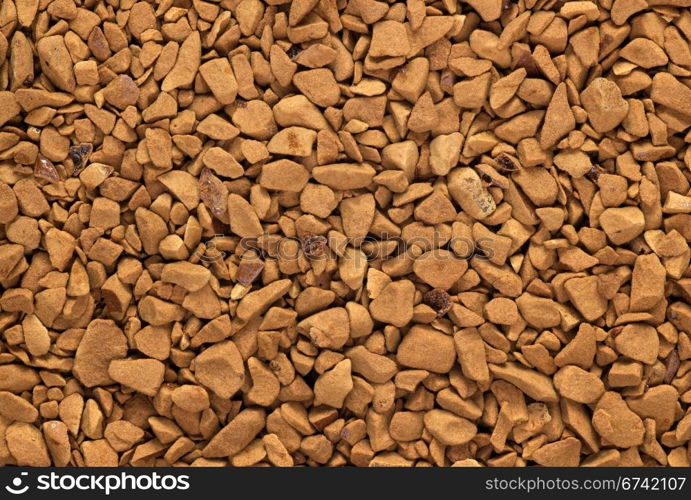 Instant coffee granules macro close up.