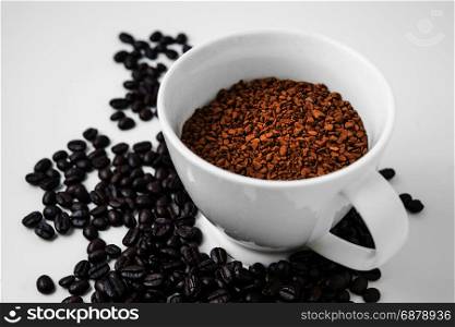 instant coffee in cup with coffe bean