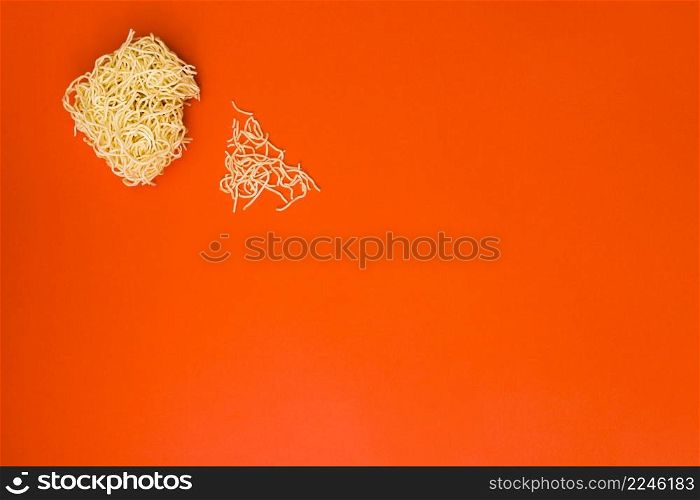 instant dry noodles broken orange background