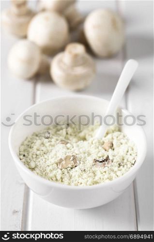 Instant mushroom soup powder in bowl, photographed with natural light (Selective Focus, Focus one third into the soup powder). Instant Mushroom Soup Powder
