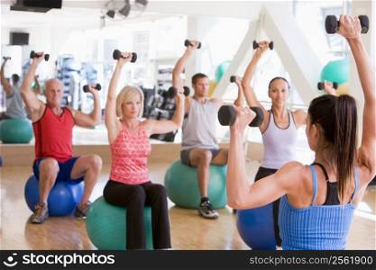 Instructor Taking Exercise Class At Gym