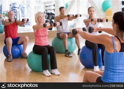 Instructor Taking Exercise Class At Gym