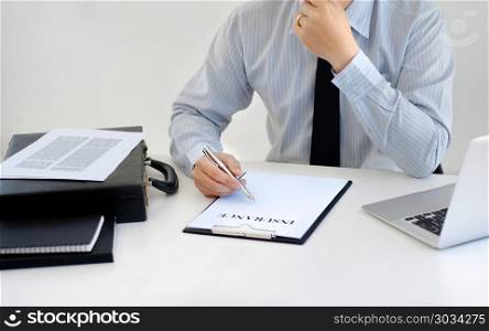 insurance agent consultant working with data report documents
