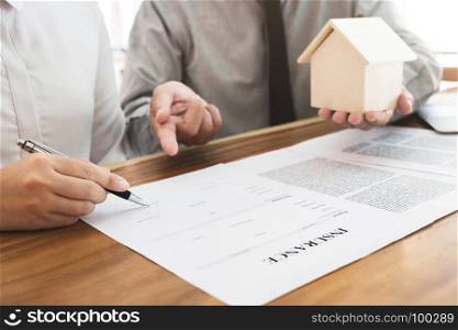 Insurance agent explain consulting with customer to signing the policy form.