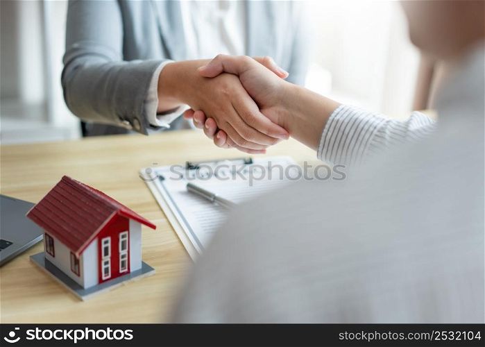 Insurance concept the chattel agent making a perfect deal of estate with his customer.