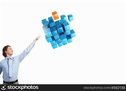Integrating new technologies. Businessman reaching hand to touch 3D rendering cube figure