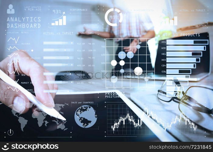 Intelligence (BI) and business analytics (BA) with key performance indicators (KPI) dashboard concept.two colleagues web designer discussing data and blank screen digital tablet and computer laptop with smartphone.