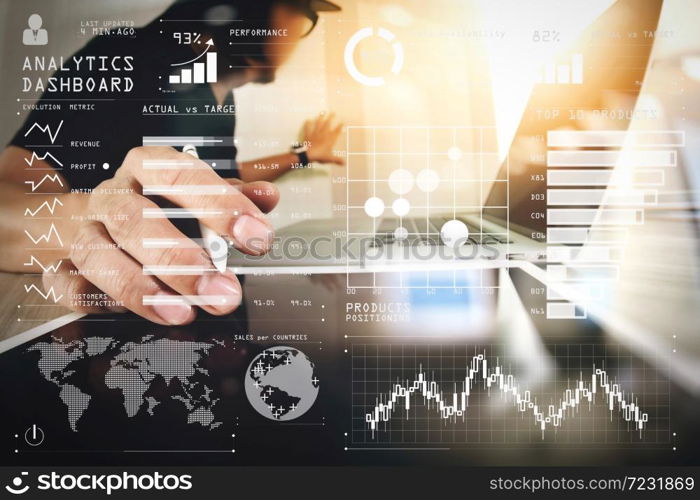 Intelligence (BI) and business analytics (BA) with key performance indicators (KPI) dashboard concept.Website designer working digital tablet and computer laptop on wooden desk.