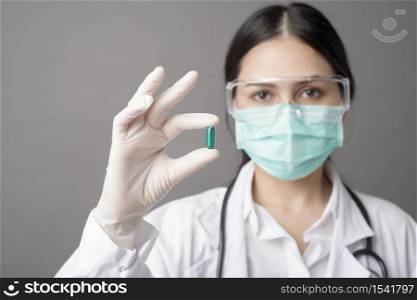 Intelligent Doctor is holding medicine pill