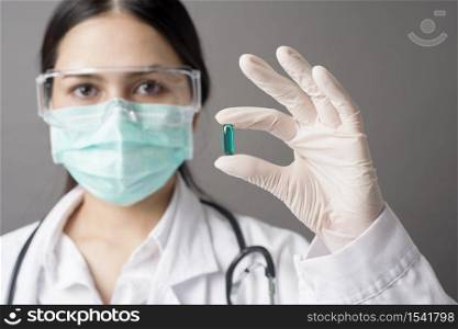 Intelligent Doctor is holding medicine pill