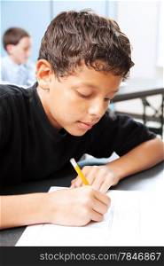 Intelligent school boy taking a standardized test in school.